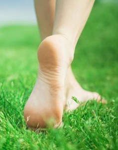 Bare feet enjoying walking in the grass